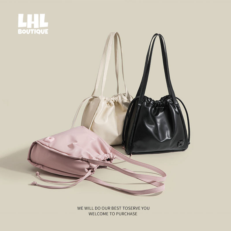 LHL BOUTIQUE ใหม่ความจุขนาดใหญ่สีชมพูนักเรียนที่เดินทางมาพักผ่อนพร็อพกระเป๋าสะพายกระเป๋า Messenger ได้