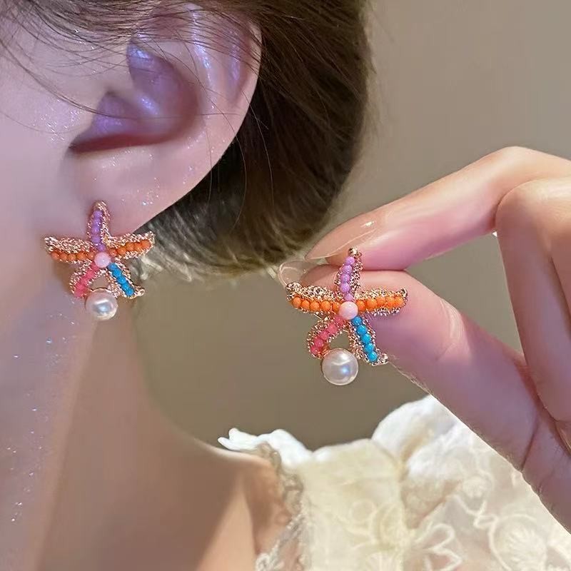 ต่างหูปลาดาวสีการออกแบบเฉพาะความรู้สึกระดับไฮเอนด์อารมณ์ต่างหูสไตล์วันหยุดชายทะเล