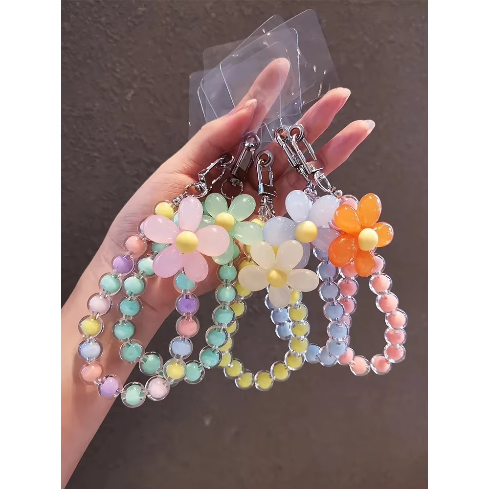 โทรศัพท์มือถือมาการองแบบใสพร้อมสายรัดข้อมือโซ่โทรศัพท์มือถือเพื่อป้องกันการสูญหาย เชือกเส้นเล็กและจี้กุญแจสุดน่ารัก