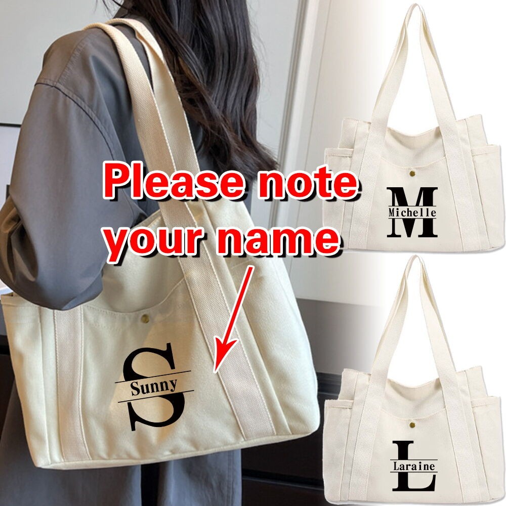 กระเป๋าผ้าใบซิปสีขาวปรับแต่งชื่อใหม่ กระเป๋าสะพายใหญ่สำหรับผู้หญิง กระเป๋าใส่แล็ปท็อป ดีไซน์ตัวอักษรสีขาว
