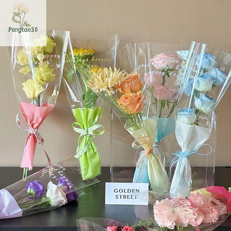 [เอ้า]  10ชิ้นแขนกุหลาบเดี่ยวถุงห่อดอกไม้ช่อถุงบรรจุภัณฑ์เซลลาโปนัทใสห่อดอกไม้สําหรับวันวาเลนไทน์ [ไทย]