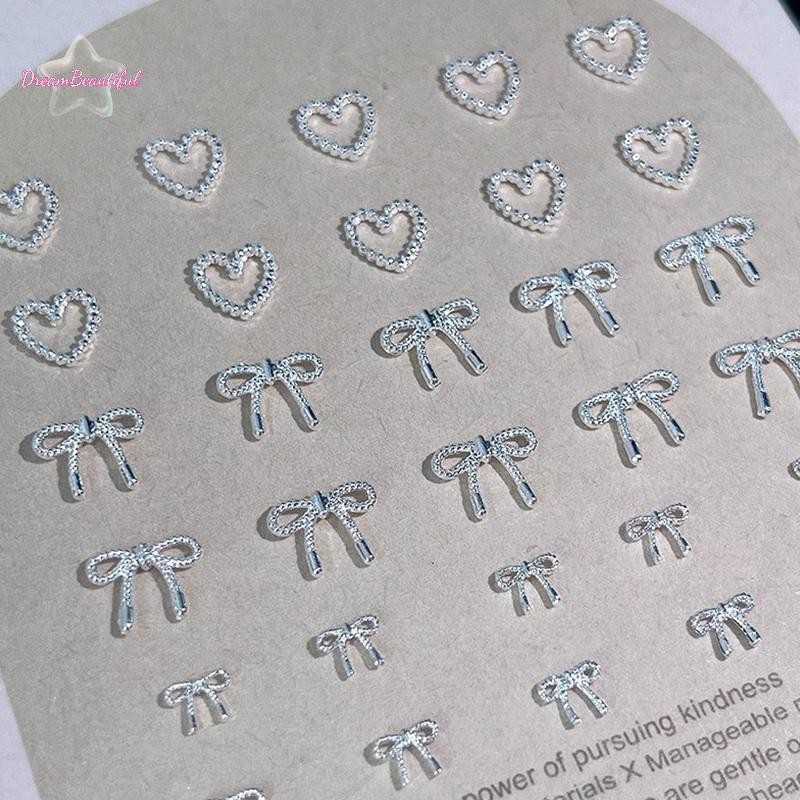 <DBFl-t> 10 ชิ้นโลหะผสม Bowknot Love Nails Art Charms ตกแต่ง 3D โลหะหรูหรา Silver Bows รูป Jewellery DIY เล็บออกแบบอุปกรณ์ใหม่