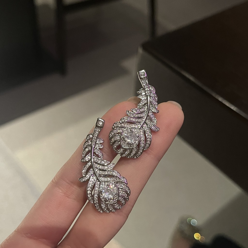 แฟชั่นใหม่ที่ไม่ซ้ํากันขนนกแหวนสร้อยคอต่างหูเครื่องประดับ