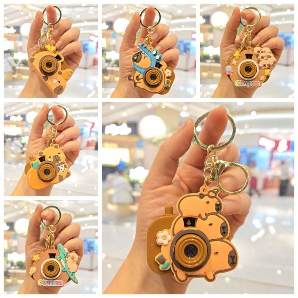 PHOECAXON Capybara พวงกุญแจ, กล้องโปรเจคเตอร์ Kawaii Kapybara จี้, Creative คีย์อุปกรณ์เสริมกระเป๋านักเรียนเครื่องประดับซิลิโคน Capybara ตุ๊กตาสาวของขวัญ ราคา ถูกที่สุด ดีลบีเคเค แกลเลอรีภาพที่ 3