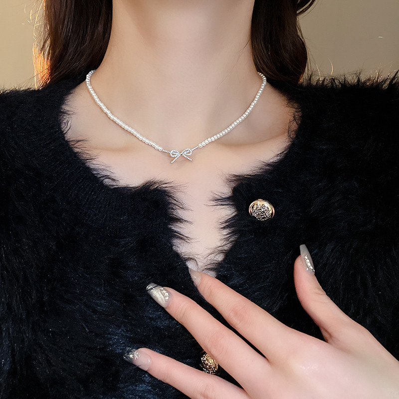 [เดรย์]ฝรั่งเศสแสงหรูหราเพทายโบว์สร้อยคอมุกซอกแฟชั่นกระดูกไหปลาร้าโซ่อารมณ์กับสร้อยคอความรู้สึกอาวุโสทั้งหมดหญิง