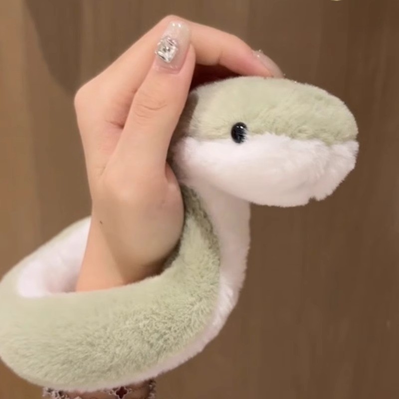 ของเล่นตุ๊กตางูการ์ตูนงูสีเขียวตุ๊กตางูนุ่มสามารถเปลี่ยนรูปร่างได้อย่างอิสระ