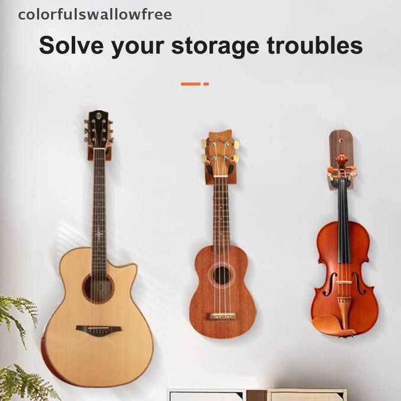 สีสันสดใสไม้ติดผนังกีตาร์ชั้นวาง Mount ติดตั้งง่ายสําหรับไวโอลิน Erhu กีตาร์เบส Ukulele เครื่องดนตรี