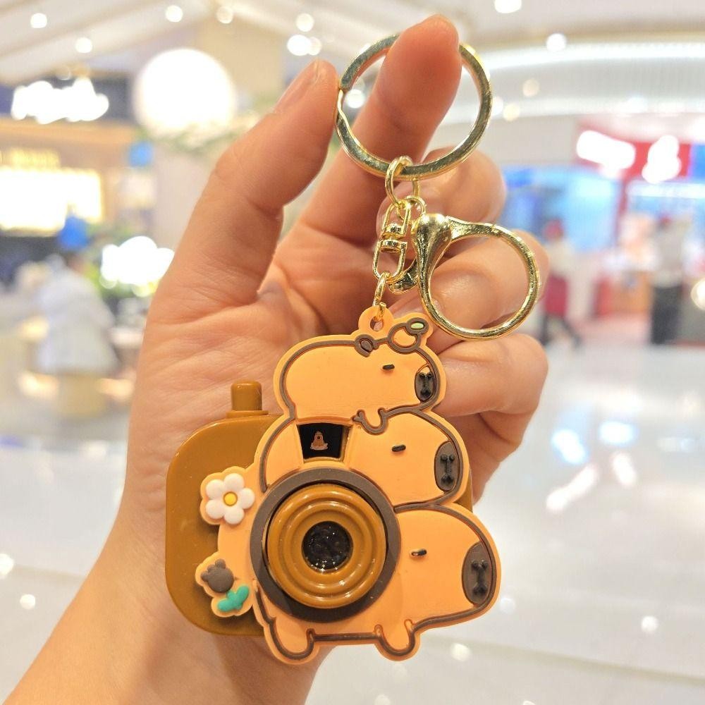 PHOECAXON Capybara พวงกุญแจ, กล้องโปรเจคเตอร์ Kawaii Kapybara จี้, Creative คีย์อุปกรณ์เสริมกระเป๋านักเรียนเครื่องประดับซิลิโคน Capybara ตุ๊กตาสาวของขวัญ ราคา ถูกที่สุด ดีลบีเคเค แกลเลอรีภาพที่ 8