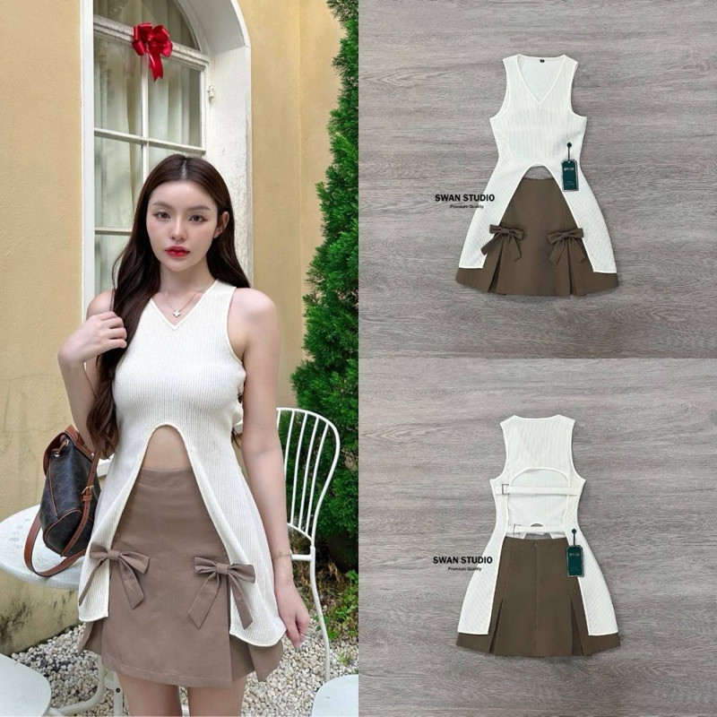 (xs-l) (พร้อมส่ง) Swan77 Set เสื้อสีครีมผ้าเนื้อร่อง ชายเสื้อเว้าสูงถึงเอว มาคู่กับกระโปรงพลีทสีน้ำต