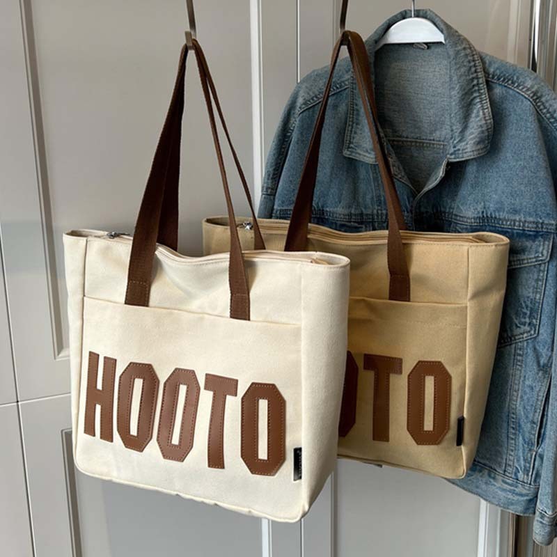 เวอร์ชั่นเกาหลีความจุขนาดใหญ่ผ้าใบกระเป๋านักเรียนหญิงชั้นไหล่สบายๆอเนกประสงค์จดหมาย สิริ ญี่ปุ่น เรียบง่าย กระเป๋าถือ