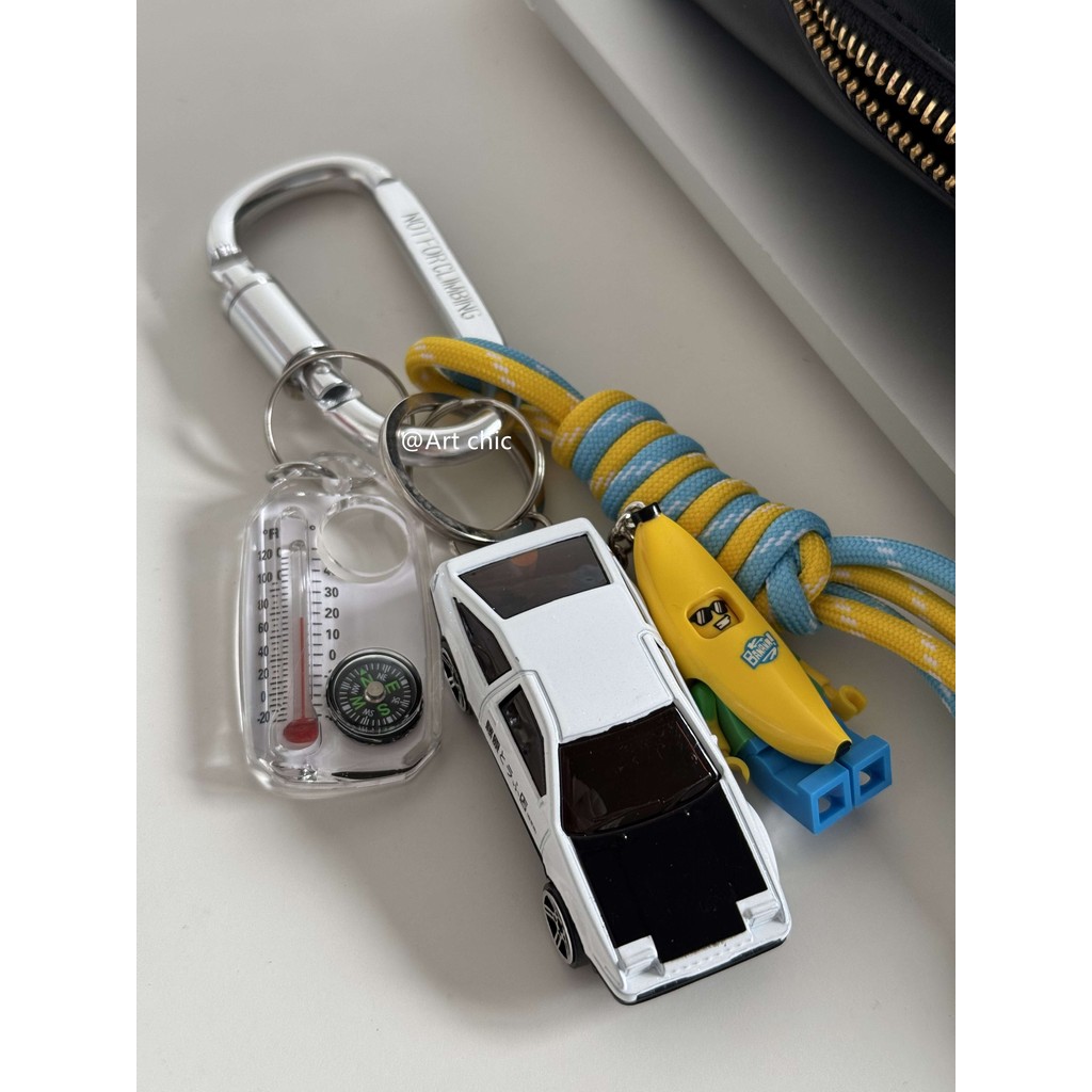 Original Unique Creative Niche Alloy Car Banana Man Bag Hanging Chain Keychain miu Tie Climbing Rope Pendant