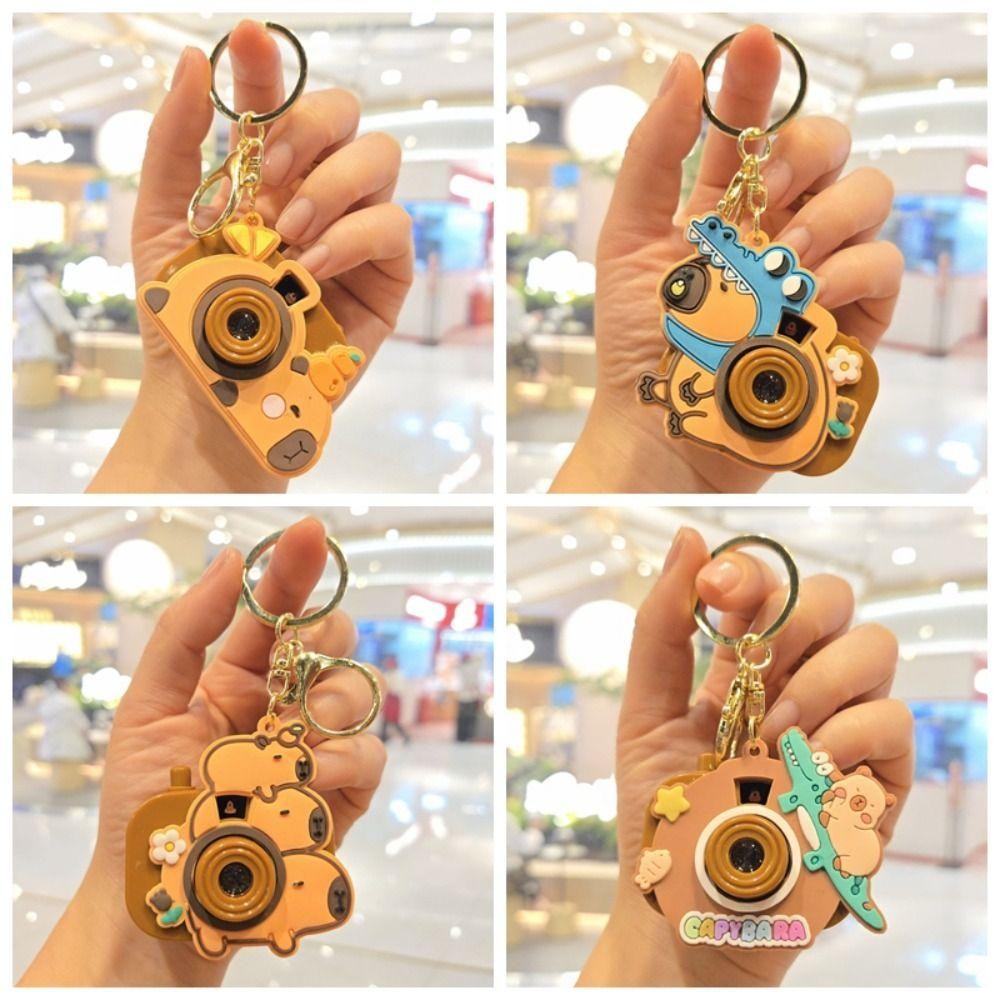 PHOECAXON Capybara พวงกุญแจ, กล้องโปรเจคเตอร์ Kawaii Kapybara จี้, Creative คีย์อุปกรณ์เสริมกระเป๋านักเรียนเครื่องประดับซิลิโคน Capybara ตุ๊กตาสาวของขวัญ ราคา ถูกที่สุด ดีลบีเคเค แกลเลอรีภาพที่ 6