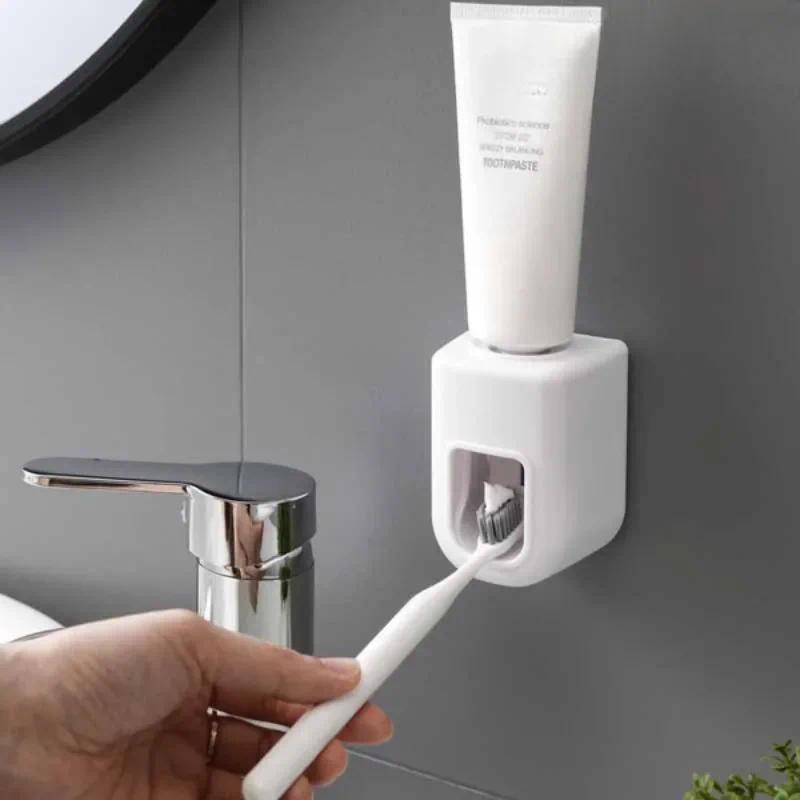 เครื่องจ่ายยาสีฟัน Squeezer ที่ใส่ยาสีฟันอัตโนมัติเจาะฟรีแฮนด์ฟรีบีบง่ายติดผนัง