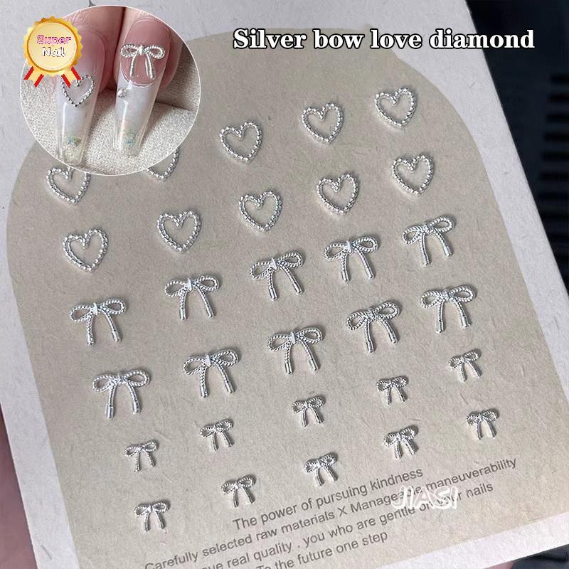 SuperNail 10pcs Alloy Bowknot Love Nails Art Charms ตกแต่ง 3D โลหะหรูหรา Silver Bows รูป Jewellery DIY เล็บออกแบบอุปกรณ์ Vary