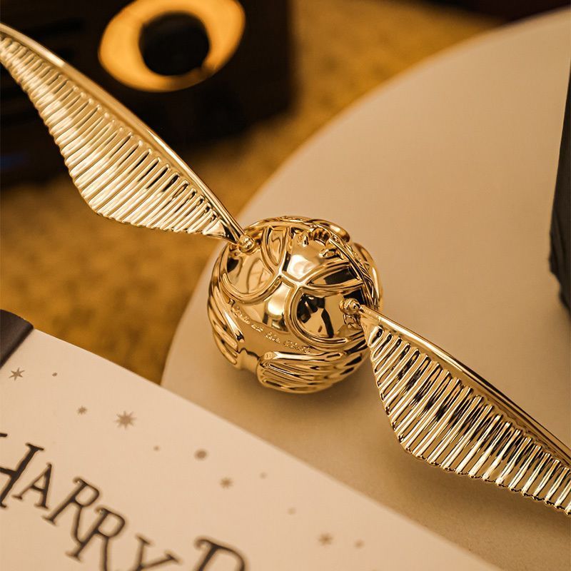 Qixi Harry Potter Golden Pirate Ring Box Wings Movable กล่องเครื่องประดับเสื้อกันหนาวสร้อยคอข้อเสนอส