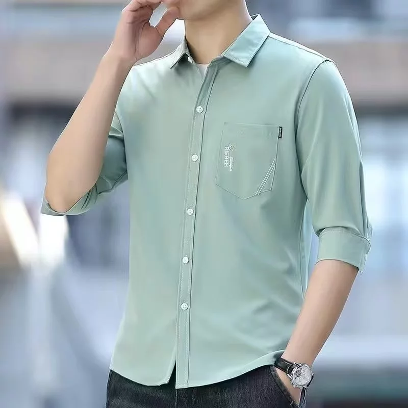ผู้ชายแฟชั่นฤดูร้อนเสื้อเชิ้ตแขนเจ็ดส่วนสำหรับผู้ชายผ้ายืด M-3XL เสื้อโปโลกับกระเป๋า