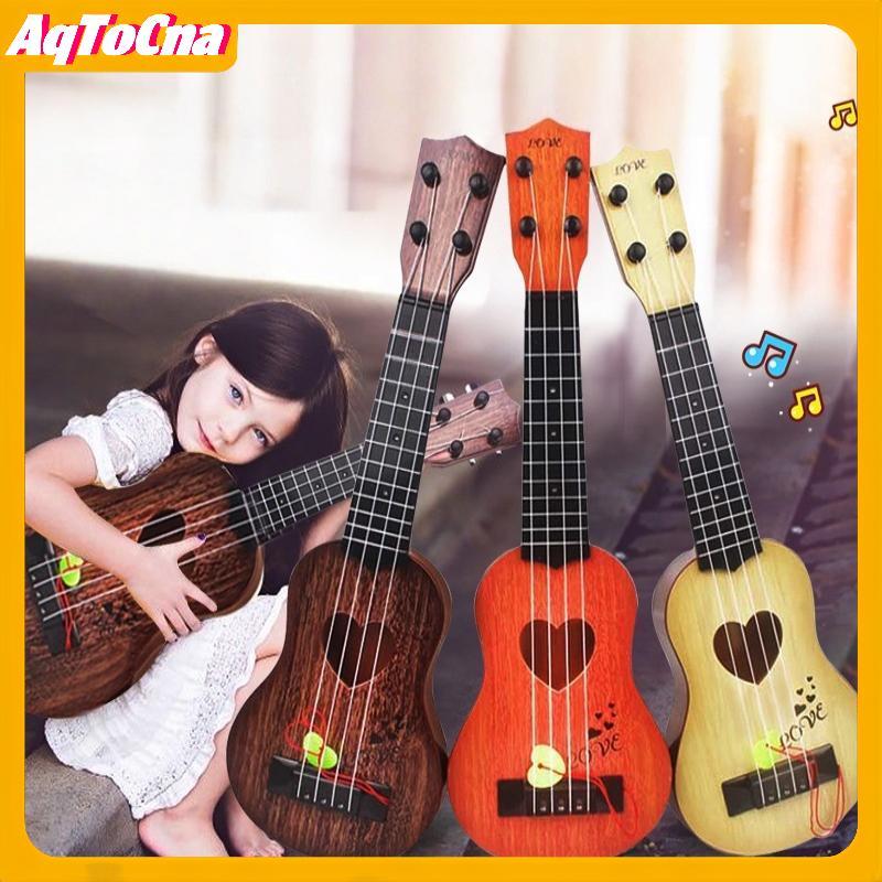 AqToCna 1 ชิ้นการเรียนรู้ของขวัญเพื่อการศึกษา 26/35 ซม.เด็กกีตาร์ 4 สายเครื่องดนตรี Paddles Simulating Yukrili ของเล่นดนตรี AqToCna