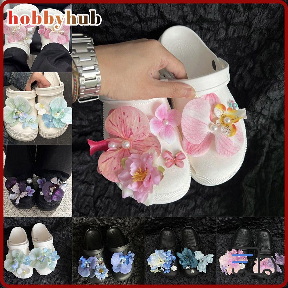 ดอกไม้และตัวประดับรองเท้า orchid & butterfly charms แบบถอดออกได้ สำหรับแต่งเสริมสร้างสรรค์