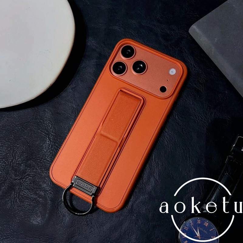 ใหม่สีส้มแบบบูรณาการสายรัดข้อมือพับยืนเหมาะสําหรับ แอปเปิล 17 โปรแม็กซ์ เคสโทรศัพท์ ไอโฟน 16 มือโปร แหวนหัวเข็มขัด 14 ผิวรู้สึก 15/13 พรีเมี่ยมอากาศฝาครอบป้