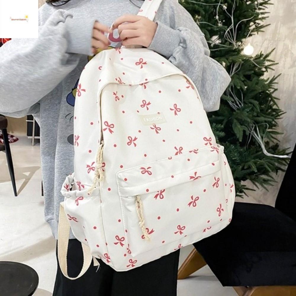 กระเป๋าเป้พิมพ์ลายโบว์ ทำจากไนลอนแบบquilting ออกแบบสำหรับนักเรียน พร้อมพื้นที่เก็บของมาก มีสายรัดไหล่ปรับระดับและโครงสร้างเสริมแรง