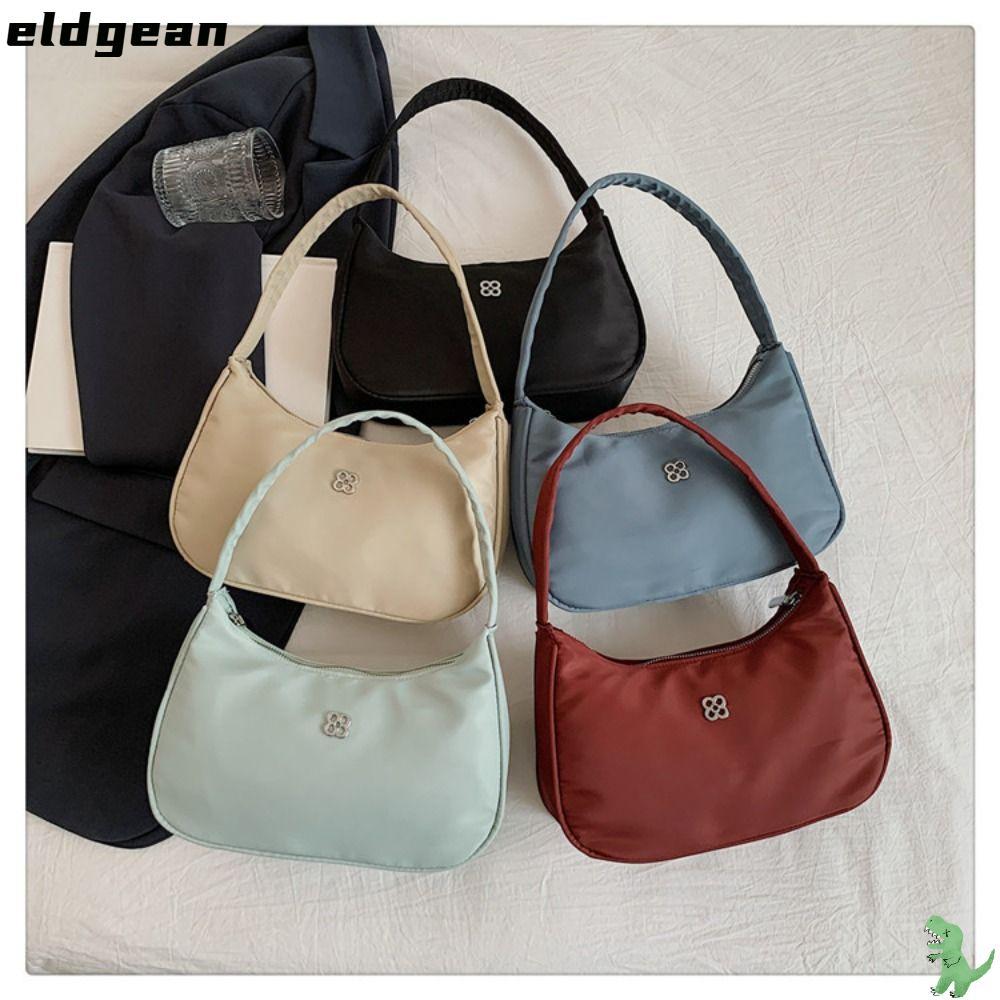 กระเป๋าสะพายไหล่เอลเลอร์ ทำจากไนลอน สีทึบ ออกแบบสำหรับผู้หญิง มีช่องใต้วงแขน และมีความจุขนาดใหญ่ เหมาะสำหรับการเดินทาง