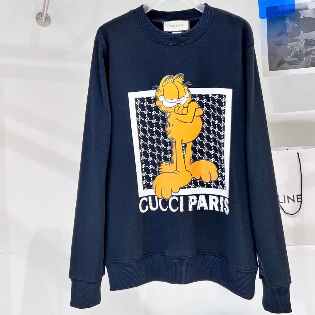 Gucci Gucci เสื้อกันหนาวผู้ชาย Street Wear การ์ตูน Garfield Co-Branded รูปแบบตัวอักษรลูกแมวพิมพ์รอบค