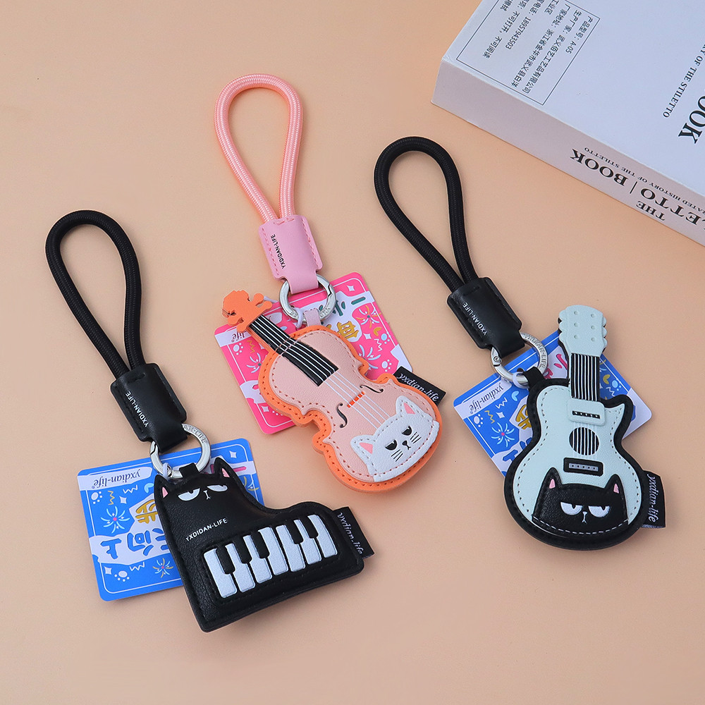 Kawaii เครื่องมือแมวพวงกุญแจ PU หนังเปียโนไวโอลินกีตาร์พวงกุญแจ Unisex กระเป๋ากุญแจรถ Charm ของขวัญ