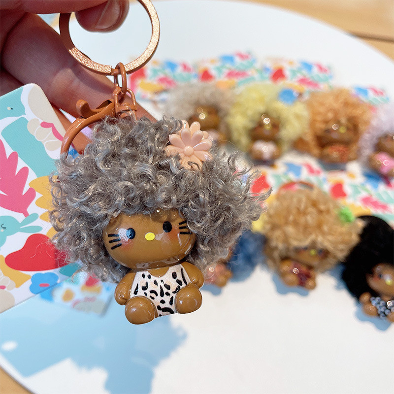 Sanrio Hello Kitty Afro ทรงผมผิวสีดํา Series ของเล่น KT พวงกุญแจน่ารักกระเป๋าจี้เด็กของขวัญ