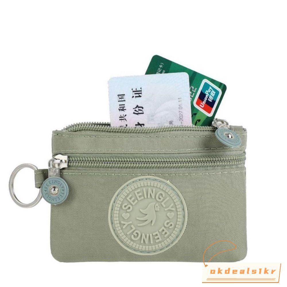 กระเป๋าใส่เหรียญและบัตรเครดิตจากผ้าใบกันน้ํา ออกแบบมาเพื่อความทนทาน มีพวงกุญแจสำหรับใช้งานได้อย่างสะดวกทั้งชายและหญิง