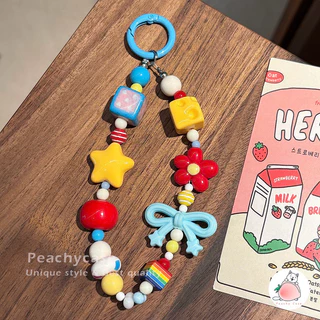 INS Star Bowknot ดอกไม้ Apple Beading Universal โทรศัพท์จี้กล้อง Lanyard Anti-lost สร้อยข้อมือสายรัดข้อมือกระเป๋า Aquarius อุปกรณ์ตกแต่งมือถือพวงกุญแจ