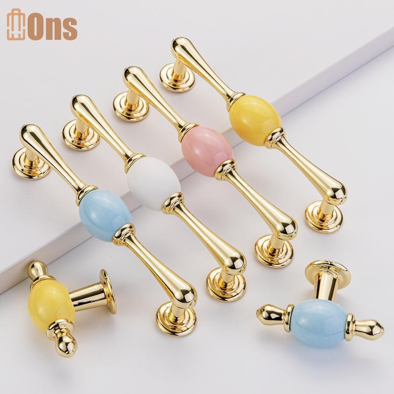 Ons Modern Golden Ceramic Drawer Pulls & Cabinet Handles สําหรับตู้เสื้อผ้าและโต๊ะเครื่องแป้งที่