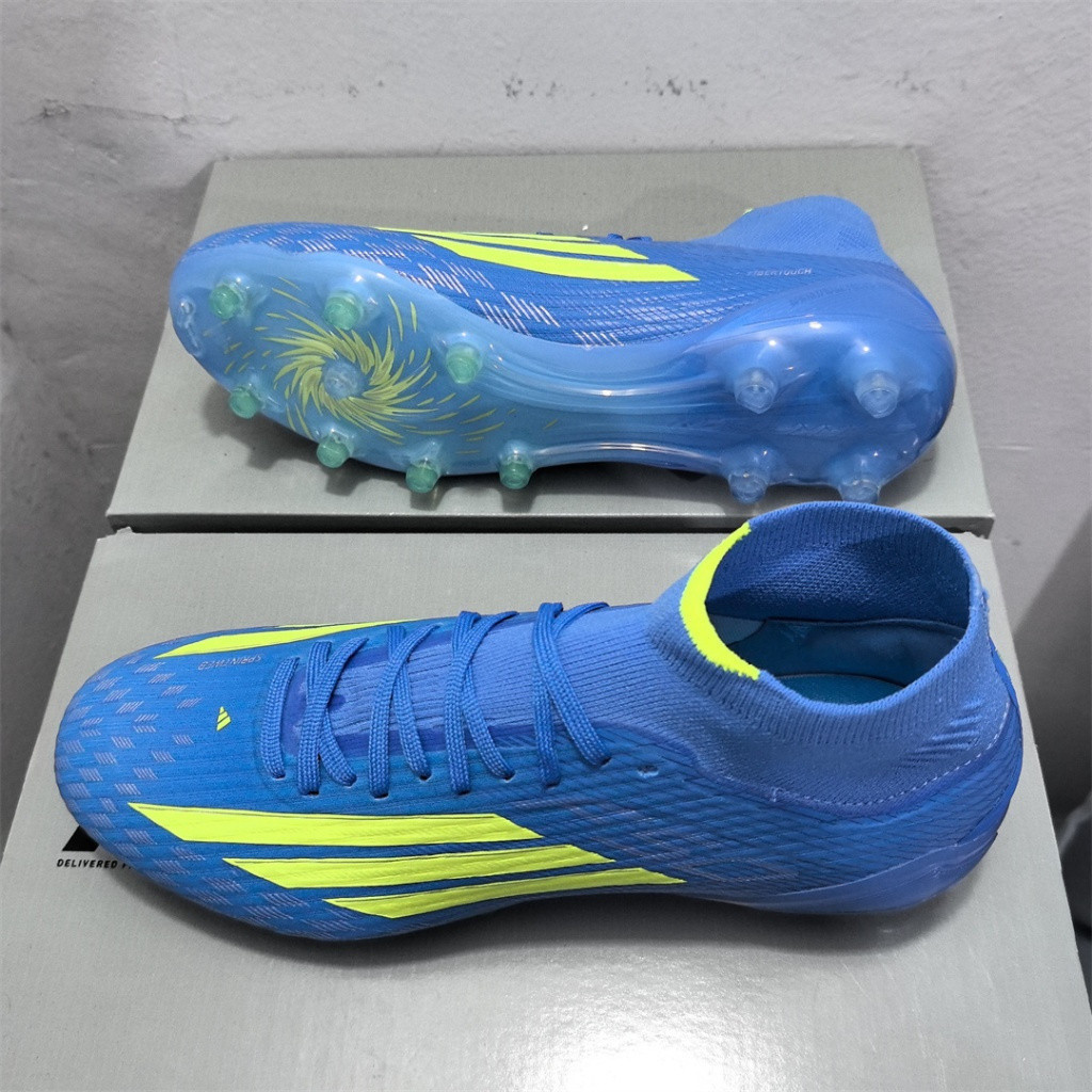 F50 High Elite Messi FG รองเท้าฟุตบอลผู้ชายสีน้ําเงินเหลืองรองเท้าฟุตบอลกันลื่นและทนต่อการสึกหรอ