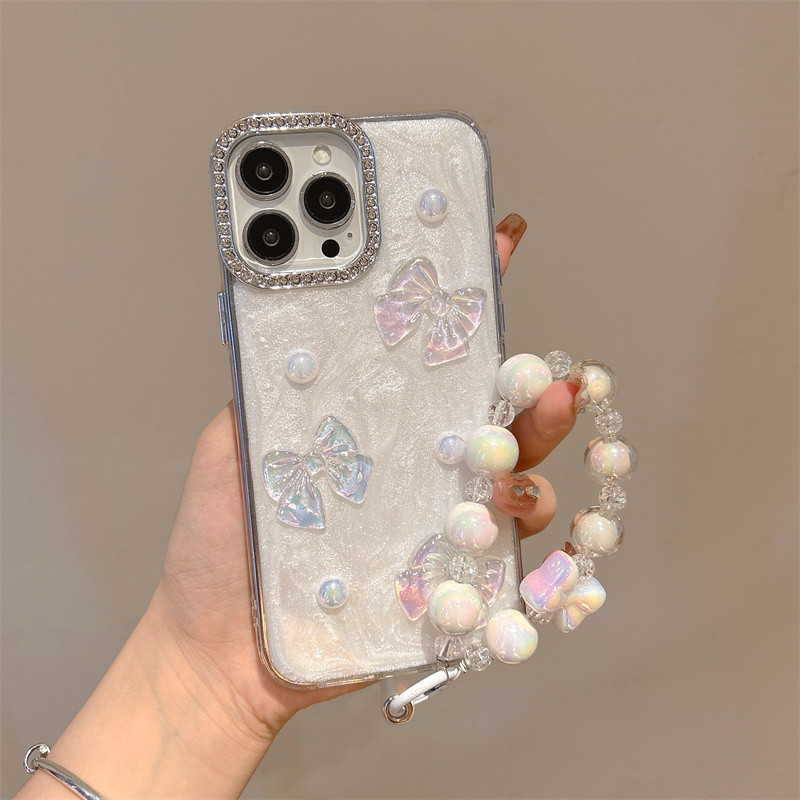 Iridescent Bow & Pearl Heart Case พร้อมสร้อยข้อมือสําหรับ Samsung Galaxy S26 S25 S24 S23 S22 S21 S20