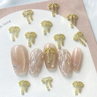 20 ชิ้นประณีตลูกไม้ Bowknot Nail Art Charms โลหะผสมทองเงินผีเสื้อตกแต่งเล็บ Rhinestones DIY