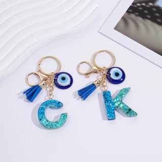 St.kunkka พวงกุญแจตัวอักษร A-Z เรซิ่น Evil Eye ดวงตาปีศาจ เครื่องรางนำโชค พร้อมพู่ สไตล์เกาหลี สำหรับห้อยกระเป๋า ของขวัญ