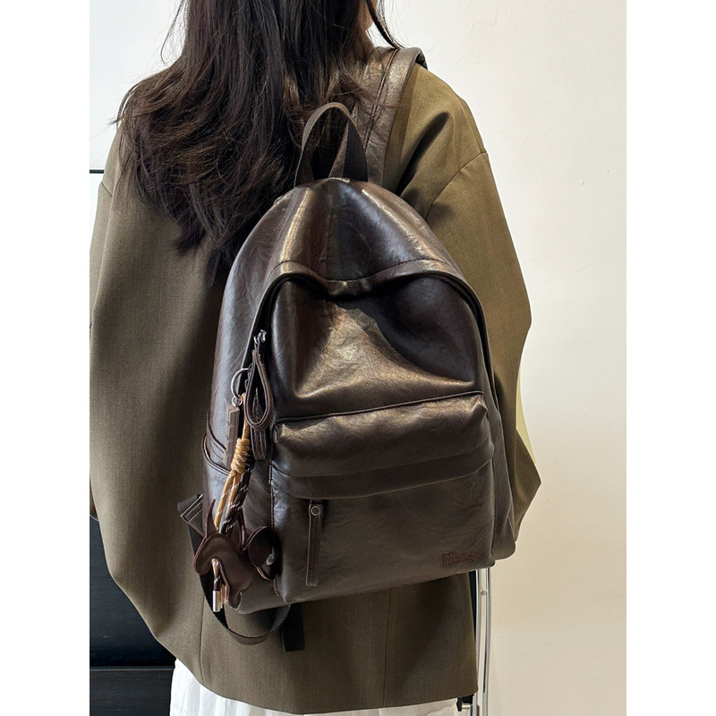 กระเป๋าเป้สะพายหลังหนังนุ่ม Retro High School ชายหญิงนักเรียน All-Match สีทึบ High-End Commuter กระเป๋าเป้สะพายหลังคอมพิวเตอร์