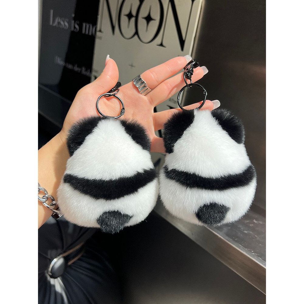 พวงกุญแจรถตุ๊กตาสีดําและสีขาวดอกไม้ Pandakk222.th20251219010203