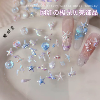 50ผสมเมจิกที่มีสีสันออโรร่าเปลือกชิ้นอุปกรณ์แต่งเล็บฤดูร้อนปลาดาวเปลือกหอยสังข์น้ําแข็งใสที่มีสีสันตกแต่งเล็บ