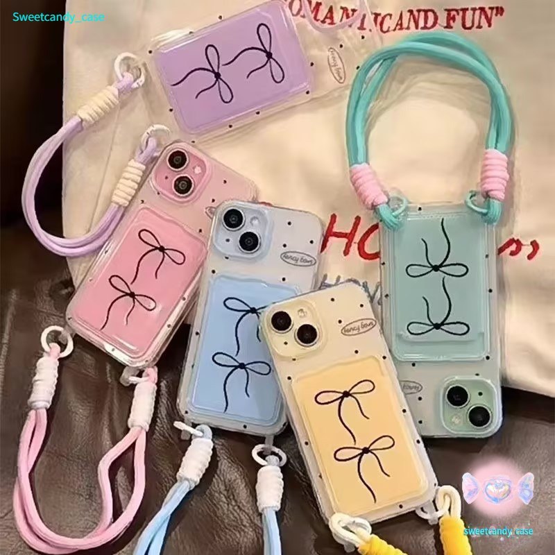 พร้อมส่ง เคสสำหรับไอโฟน14 ลายจุดโบว์ดำสดใส เคสช่องใส่การ์ดสายข้อมือ For iPhone17 16 11 12 13PRO MAX 14 15PLUS 7/8 SE2 XR