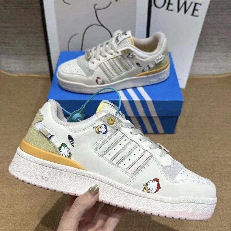 ขายร้อน Joint Donald Duck Campus ผู้ชายผู้หญิงฤดูร้อนรองเท้าคู่ทุกคู่รองเท้าผ้าใบกีฬาลําลอง