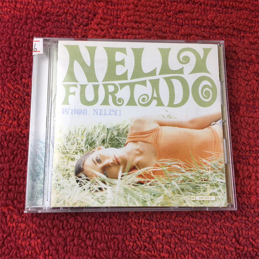 Nelly Furtado Woa Nelly (Unsealing ) hang1 CD และหน้ากระดาษก็ดี