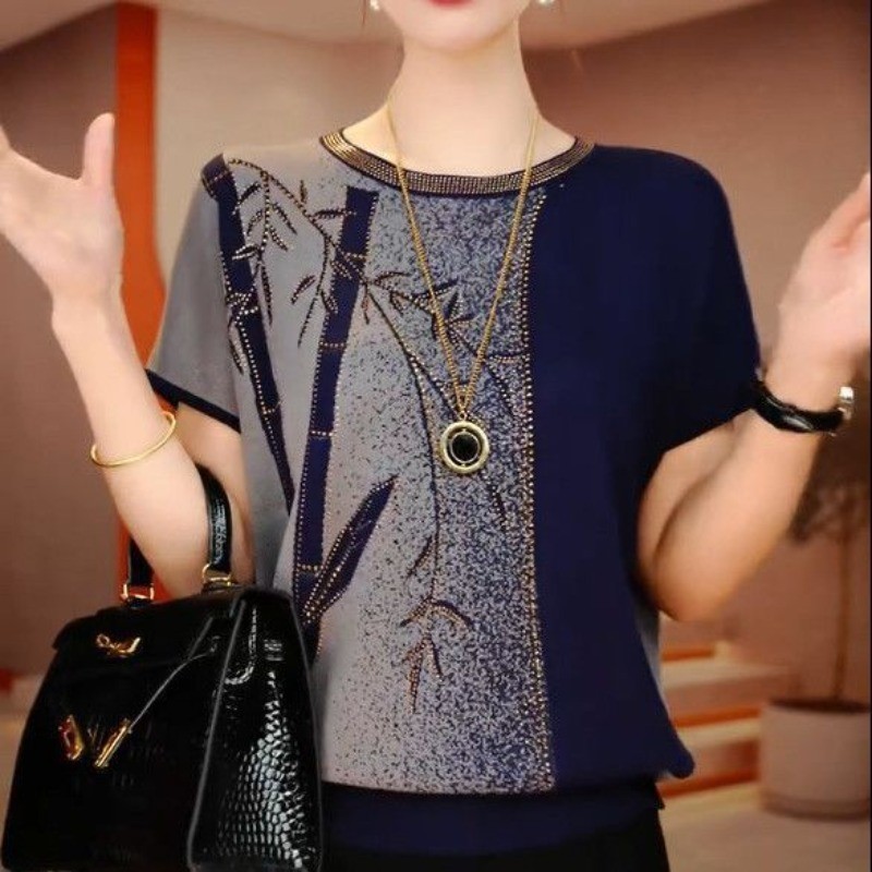 เสื้อยืดย้อนยุคของผู้หญิงฤดูร้อนใหม่คอกลมสลิมมิ่งระบายอากาศแฟชั่นหลวมสบายๆสบายถักเสื้อกันหนาว