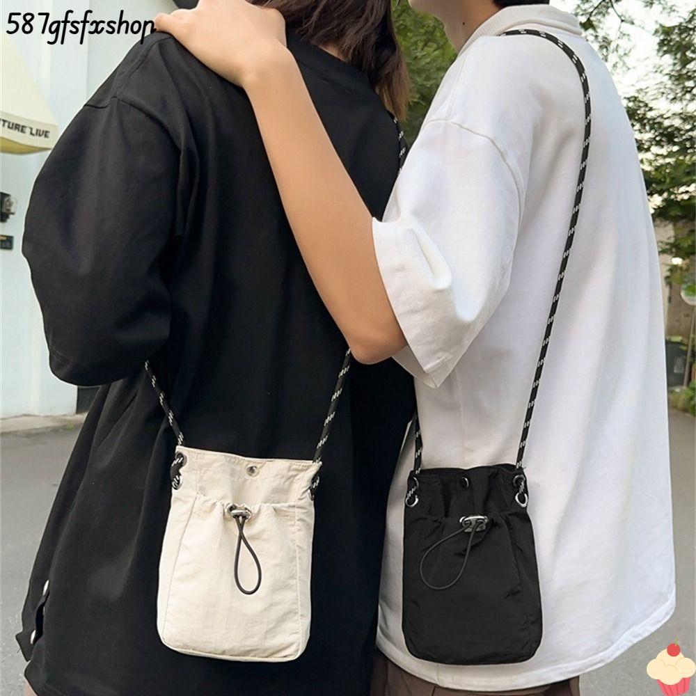 กระเป๋าสะพายข้างแบบมินิมอล น้ำหนักเบาทรงตัวด้วยผ้าใบ สำหรับใช้งานกลางแจ้งและเก็บของได้สะดวก