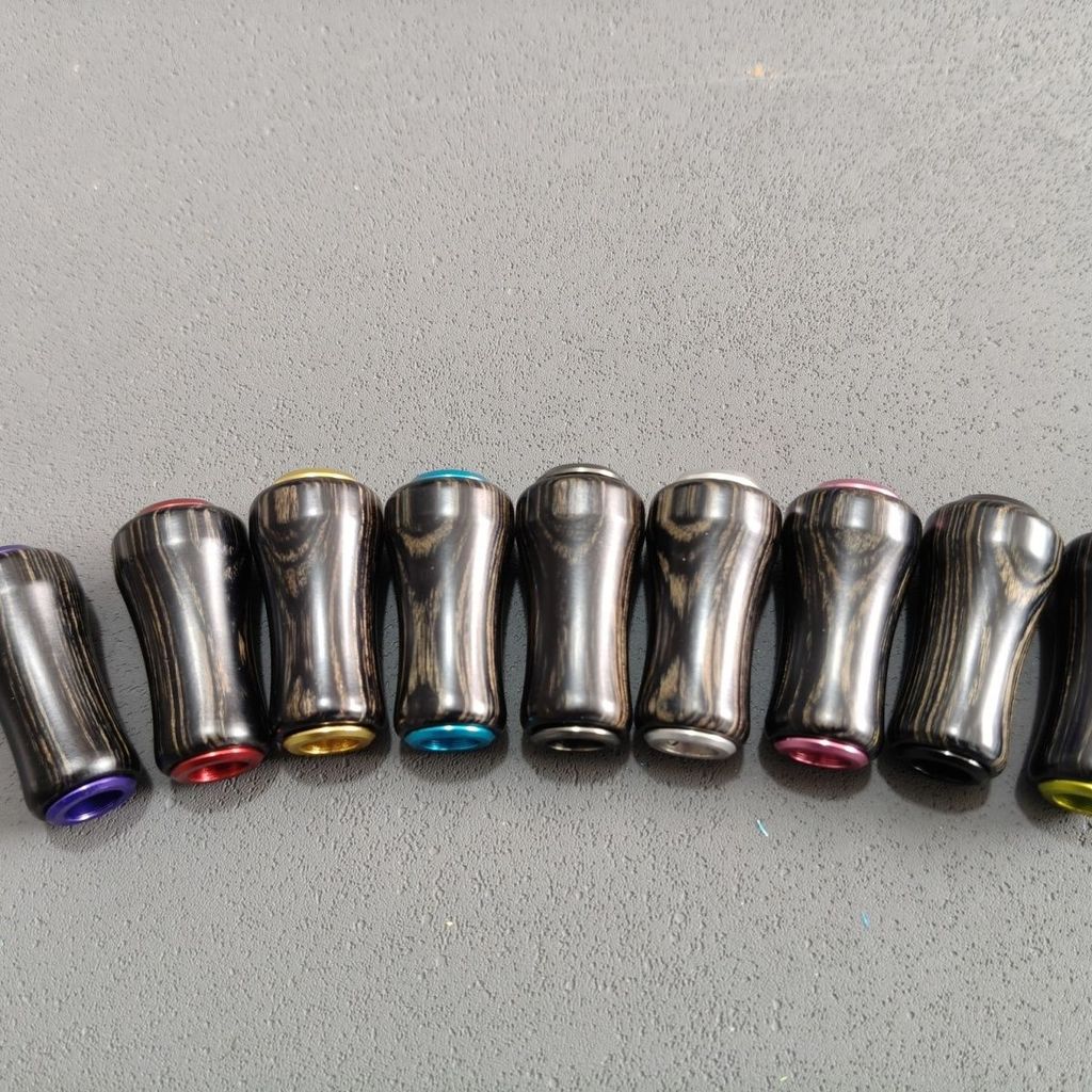 SHIMANO ลูกบิดไม้เนื้อแข็งสีดำจากมะเกลือ ใช้งานกับรอกสปินนิ่งและเบทคาสติ้ง