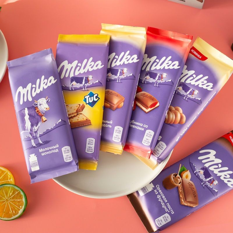 นําเข้าเยอรมันมิลค์ก้าช็อกโกแลตโอรีโอบิสกิตเติม进口德国Milka卡克力奥利干夹心牛奶气泡可爱气泡可型0422