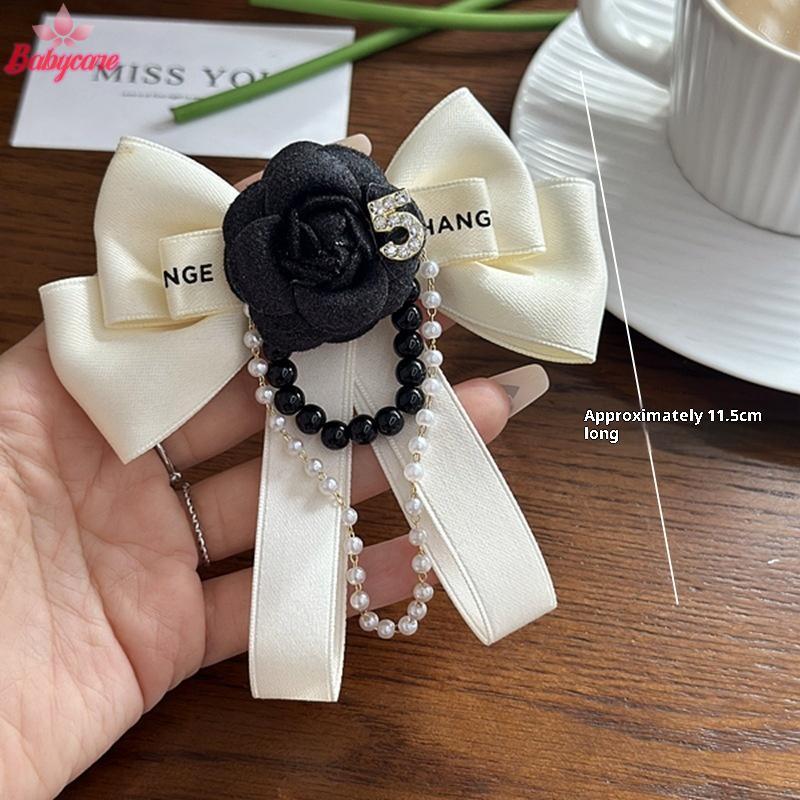 เข็มกลัดดอกไม้และเนคไทโบว์แบบอเนกประสงค์ จากผ้าCamellia สไตล์สำหรับงานแต่งงาน