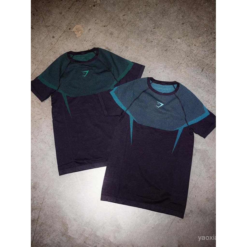 ถุงน่องและเสื้อยืดแขนสั้นไม่มีรอยต่อ สีนิล สำหรับการออกกำลังกายที่โรงยิม ออกแบบใหม่ให้สวมใส่ง่ายและยืดหยุ่น