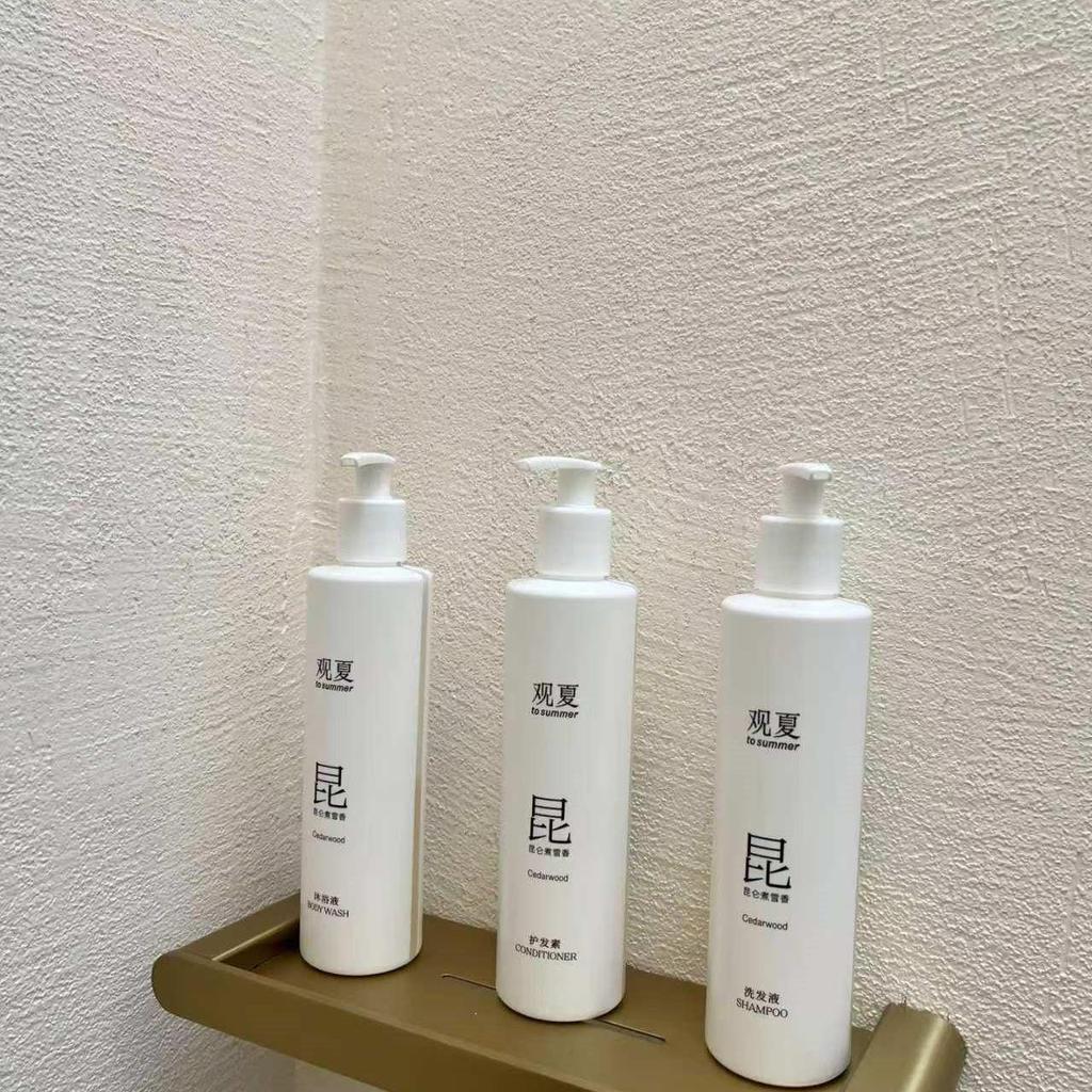 Guanxia Kunlun ต้มหิมะพิเศษสําหรับโรงแรมแชมพูครีมนวดผม Body Wash 300ml