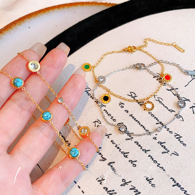 สร้อยข้อมือดีไซน์ประณีตจากเหล็กไทเทเนียม สีฟ้าอมเขียว