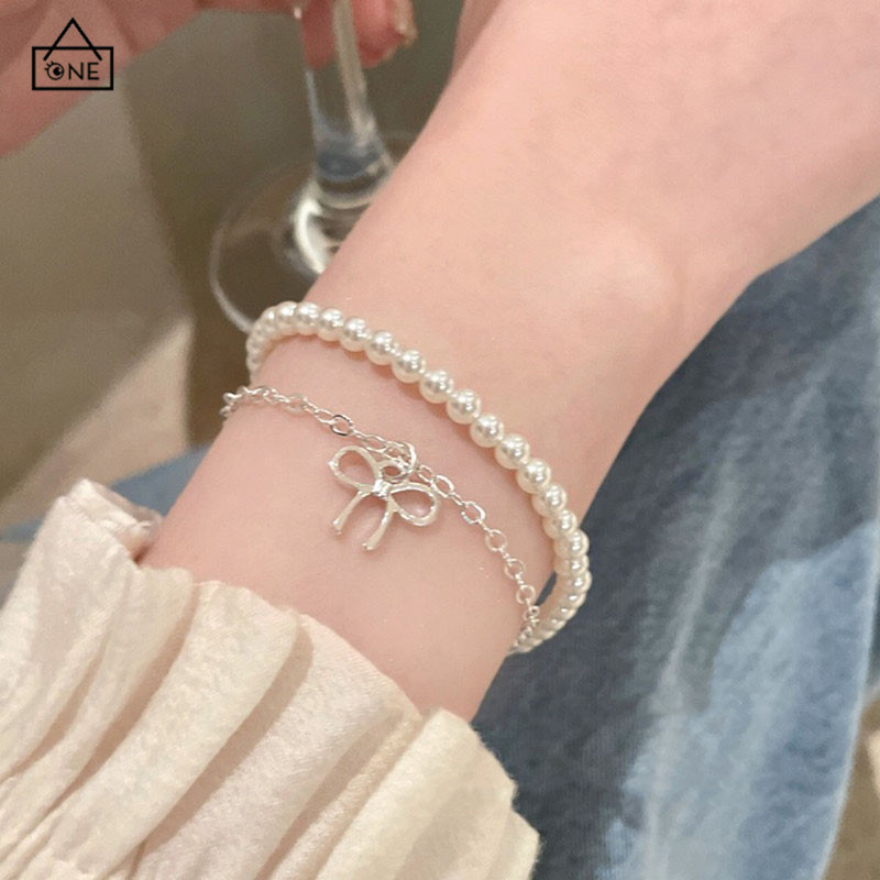 COD❤️สร้อยข้อมือลูกปัดมุกสองชั้นโบว์สไตล์เกาหลีแฟชั่นระดับไฮเอนด์เครื่องประดับสำหรับผู้หญิง-a.one
